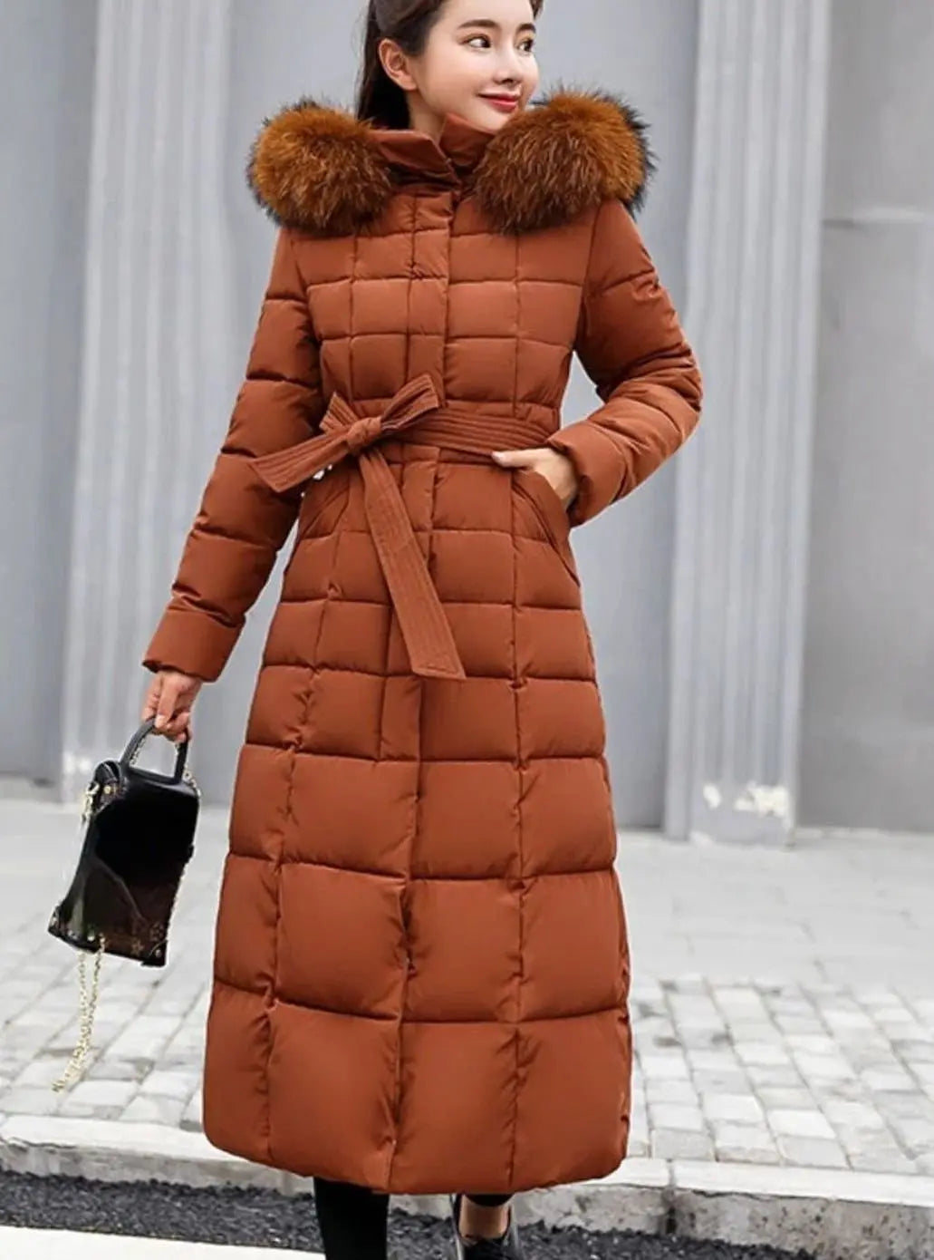 Women's Long Belted Quilted Hooded Puffer Coat with Fur Trim